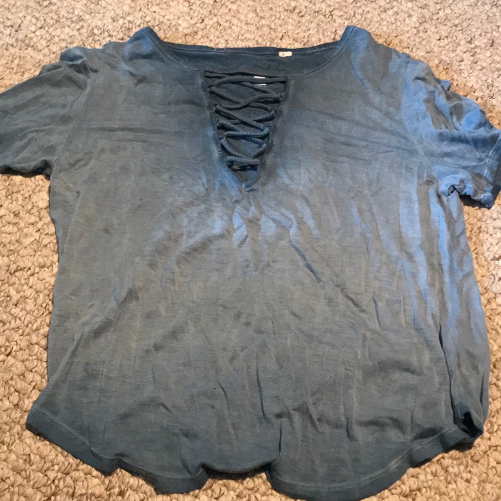 blue shirt with crosses in front